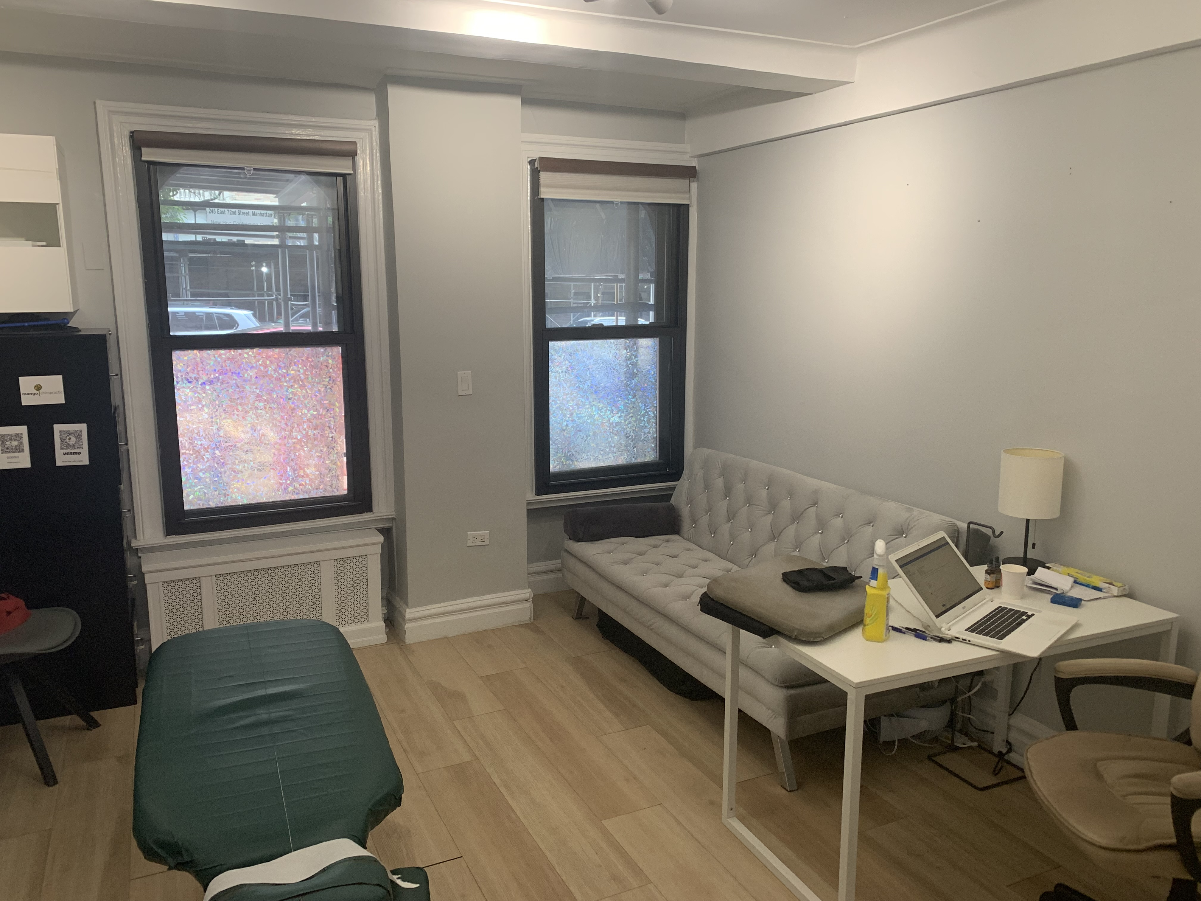 Cozy office living area with couch and lamp